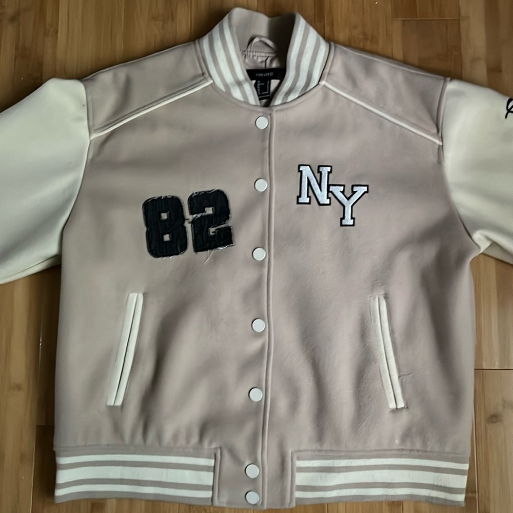 Cute beige,NYC themed varsity jacket,from forever 21 size: US Small